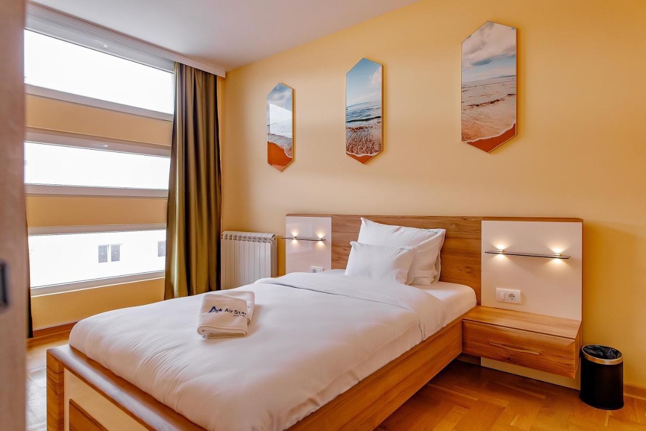 Airstar Hotel Surcin Bagian luar foto