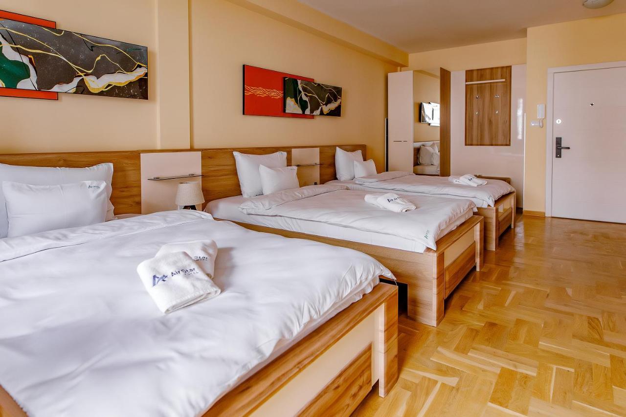 Airstar Hotel Surcin Bagian luar foto