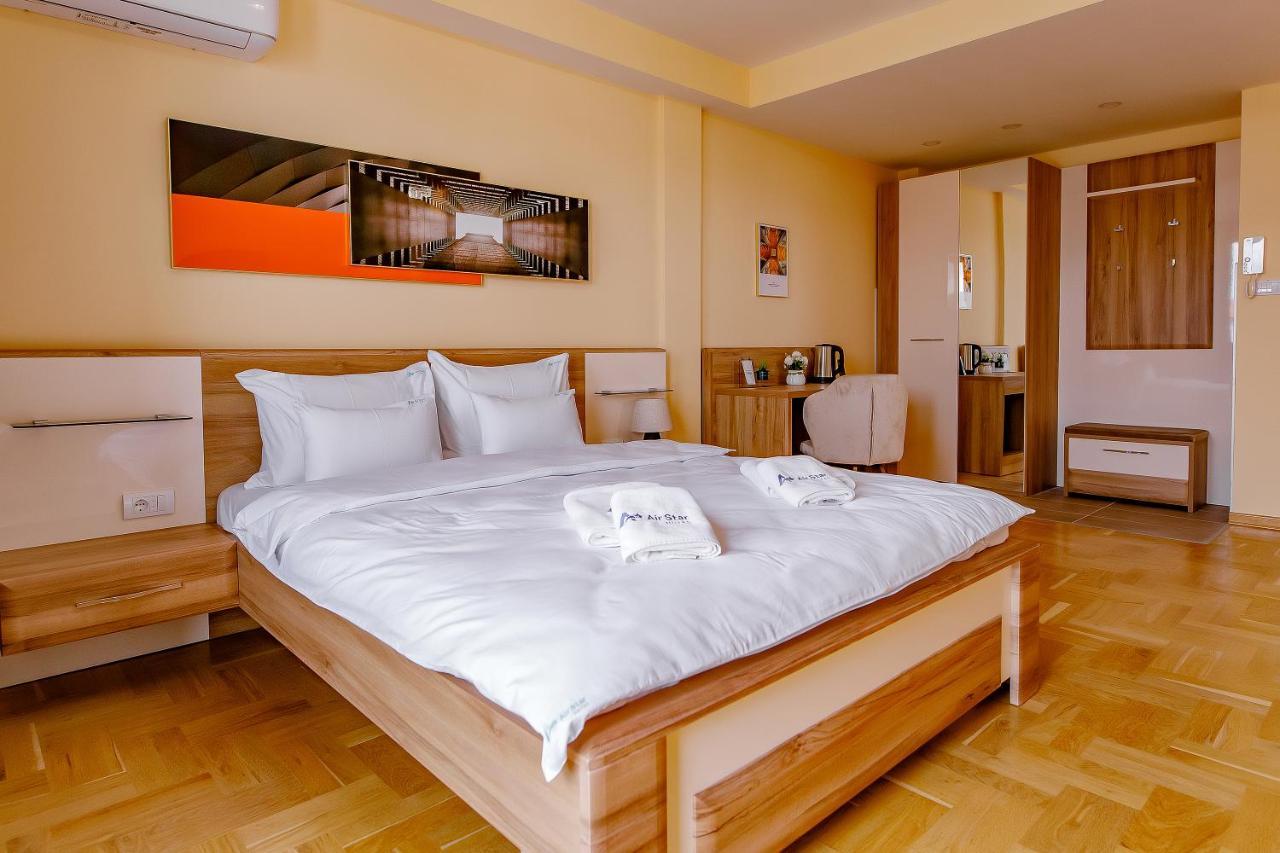 Airstar Hotel Surcin Bagian luar foto