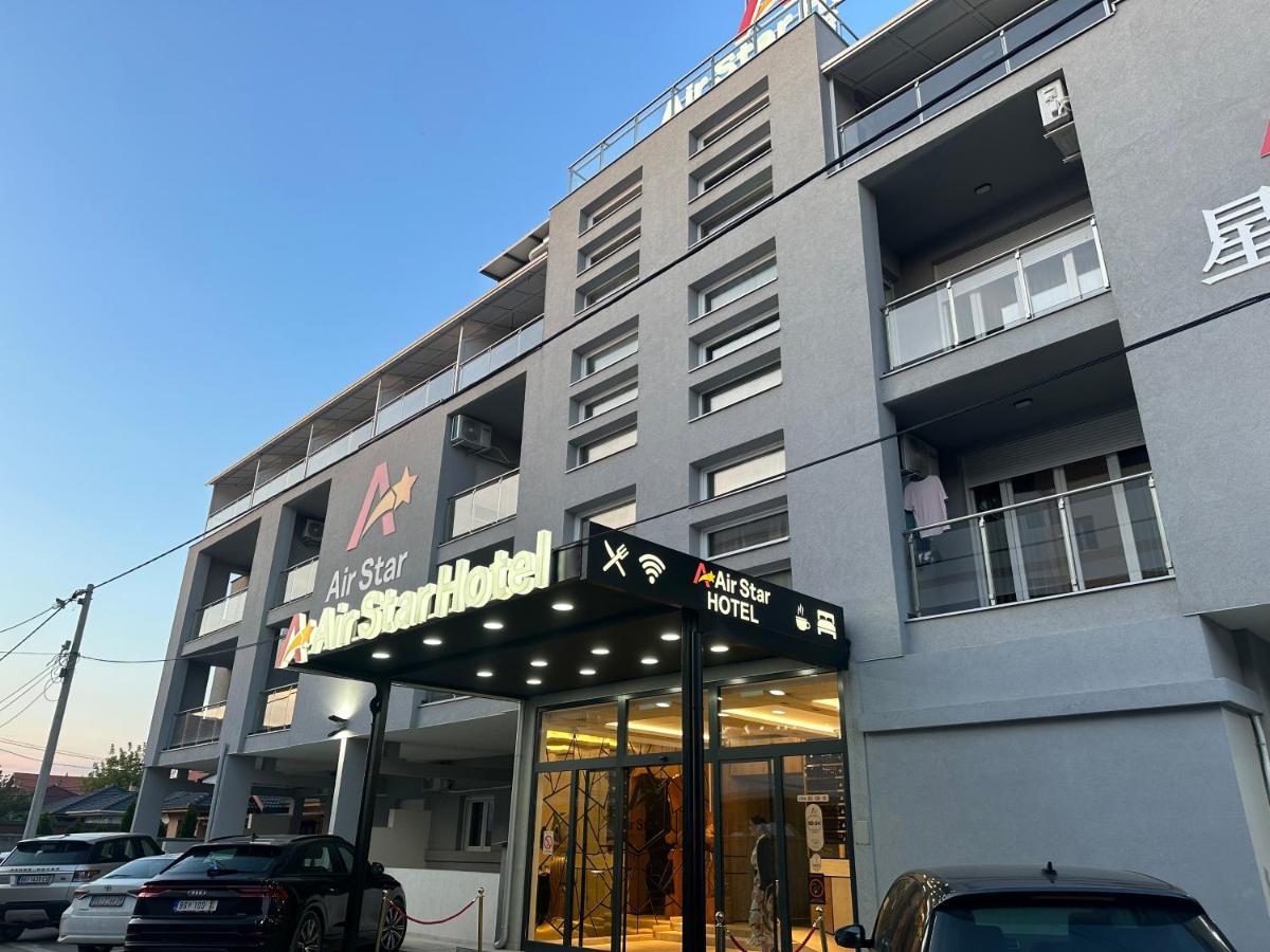 Airstar Hotel Surcin Bagian luar foto