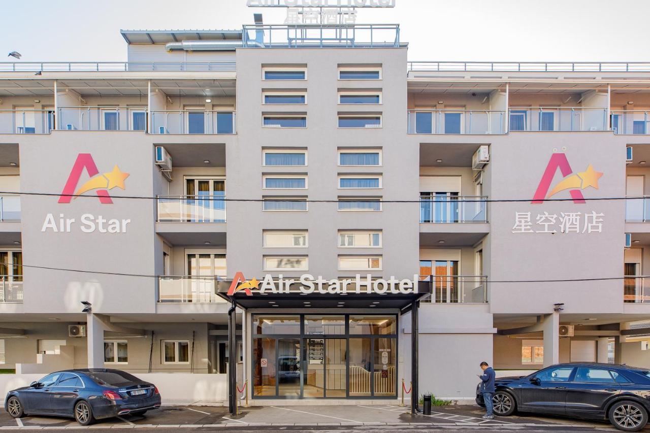 Airstar Hotel Surcin Bagian luar foto